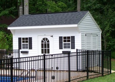 10 x 14 V-Carriage with white siding and trim, black shutters and shingles, 1' taller walls and fiberglass single door