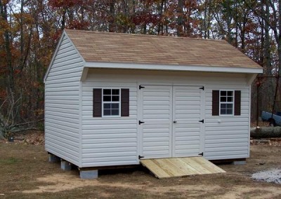 12 x 16 V-Carriage with silvermist siding and trim, desert tan shingles and dark brown shutters