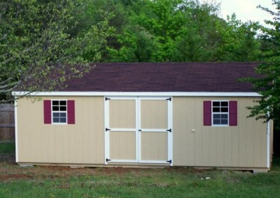 12 x 24 Painted A-roof painted a custom tan color with brownwood shingles, white trim and maroon shutters