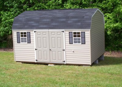 12 x 16 V-High Barn with clay siding, white trim, black shingles and shutters, and fiber doors