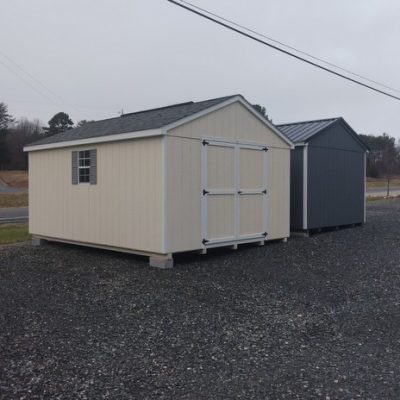 12 x 16 size painted a-roof style shed with navajo white siding, white trim, estate gray architectural shingle roof, gray shutters, 8' ridge vent, ggs 6 foot doors, two windows.