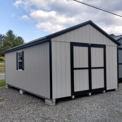 12 x 20 size painted a-roof style shed with gap gray siding, black trim, black metal roof, black shutters, ggs 6 foot doors, two windows.